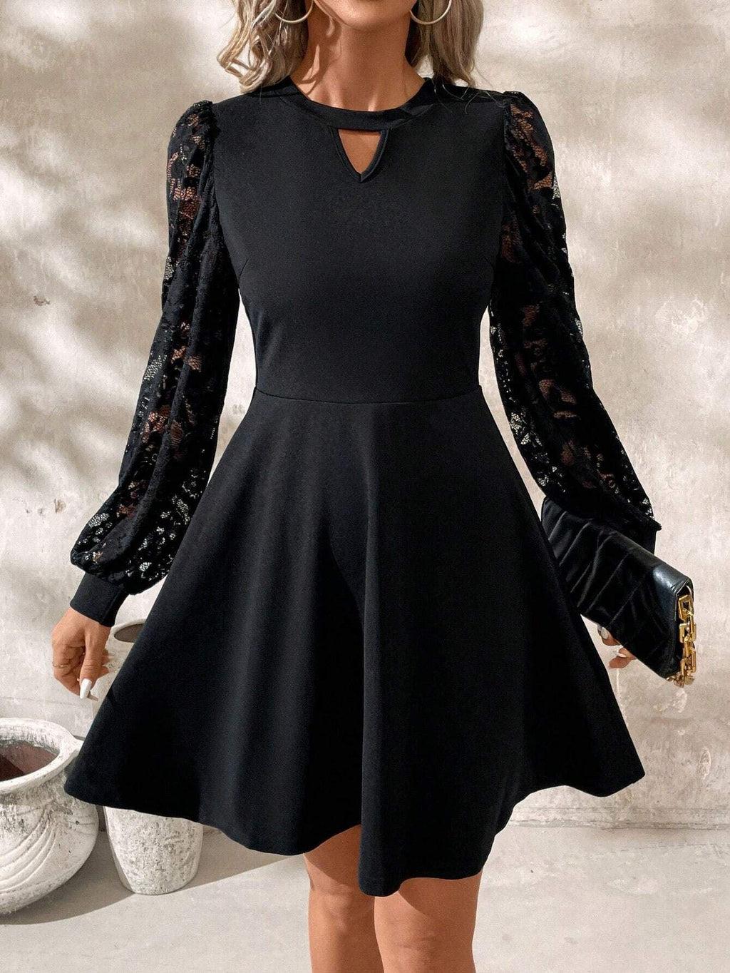2024 new elegant women's black crew neck lace splicing long-sleeved slim-fitting horn hem jumpsuit